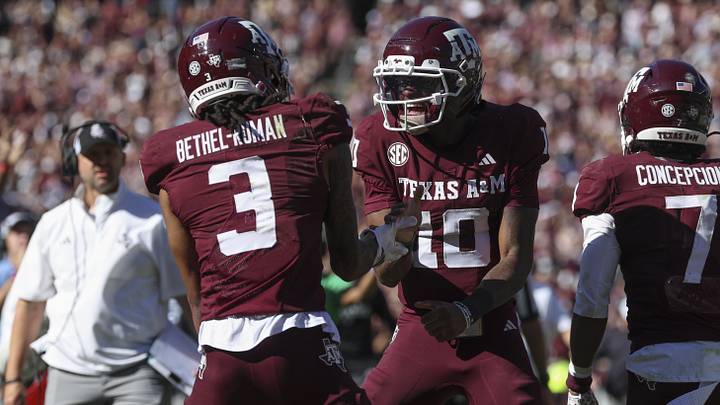 Nov 15, 2025; College Station, Texas, USA; Texas A&M Aggies quarterback Marcel Reed (10) celebrates with wide receiver Ashton Bethel-Roman (3) after a touchdown during the third quarter against the South Carolina Gamecocks at Kyle Field. Mandatory Credit: Troy Taormina-Imagn Images Nov 15, 2025; College Station, Texas, USA; Texas A&M Aggies quarterback Marcel Reed (10) celebrates with wide receiver Ashton Bethel-Roman (3) after a touchdown during the third quarter against the South Carolina Gamecocks at Kyle Field. Mandatory Credit: Troy Taormina-Imagn Images