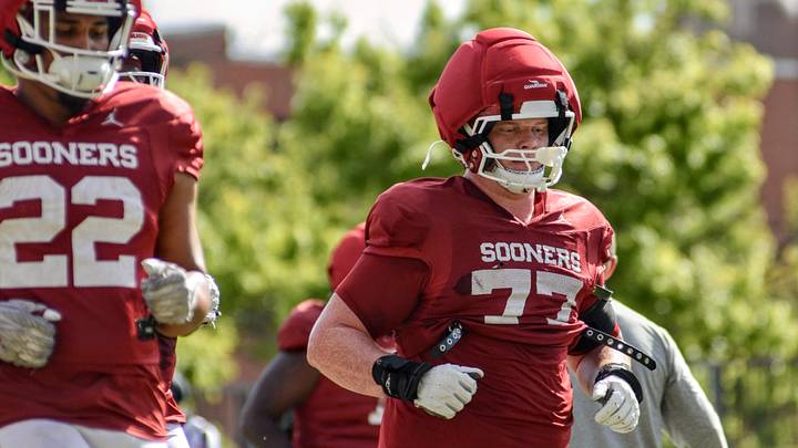 Oklahoma offensive lineman Heath Ozaeta jogs during practice.