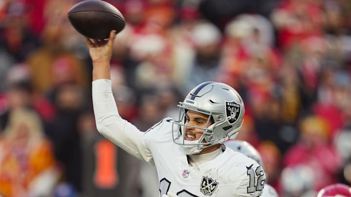 Nov 29, 2024; Kansas City, Missouri, USA; Las Vegas Raiders quarterback Aidan O'Connell (12) throws a pass during the second half against the Kansas City Chiefs at GEHA Field at Arrowhead Stadium. Mandatory Credit: Jay Biggerstaff-Imagn Images