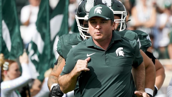 Sep 13, 2025; East Lansing, Michigan, USA; Michigan State head coach Jonathan Smith takes the field before a game against Youngstown State at Spartan Stadium. 
