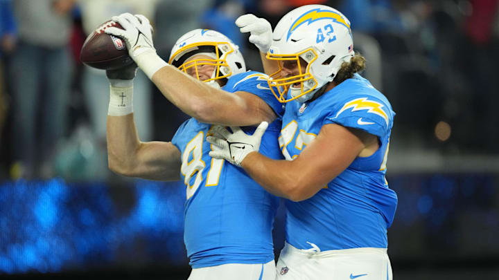 Los Angeles Chargers tight end Will Dissly (81) celebrates with tight end Tucker Fisk (42) after scoring on a 29-yard touchdown reception against the Cincinnati Bengals in the first half at SoFi Stadium.