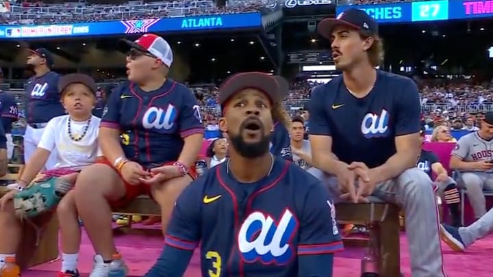 Minnesota Twins' Byron Buxton reacts to James Wood hitting a home run at the HR Derby.