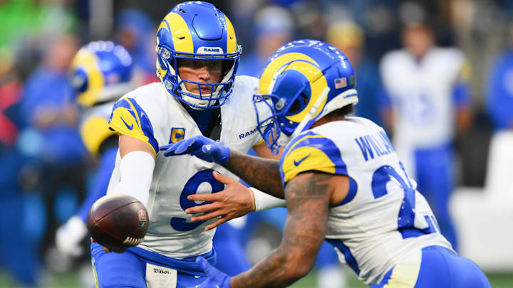 Nov 3, 2024; Seattle, Washington, USA; Los Angeles Rams quarterback Matthew Stafford (9) hands the ball off to running back Kyren Williams (23) during the second half against the Seattle Seahawks at Lumen Field. Mandatory Credit: Steven Bisig-Imagn Images