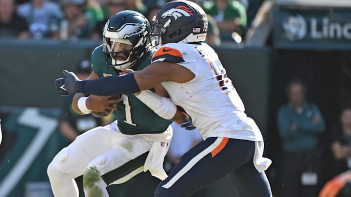 Oct 5, 2025; Philadelphia, Pennsylvania, USA; Philadelphia Eagles quarterback Jalen Hurts (1) is sacked by Denver Broncos linebacker Nik Bonitto (15) at Lincoln Financial Field. Oct 5, 2025; Philadelphia, Pennsylvania, USA; Philadelphia Eagles quarterback Jalen Hurts (1) is sacked by Denver Broncos linebacker Nik Bonitto (15) at Lincoln Financial Field.