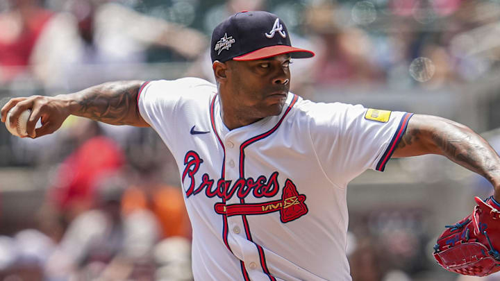 May 15, 2025; Cumberland, Georgia, USA; Atlanta Braves pitcher Raisel Iglesias (26) pitches against the Washington Nationals during the ninth inning at Truist Park. Mandatory Credit: Dale Zanine-Imagn Images