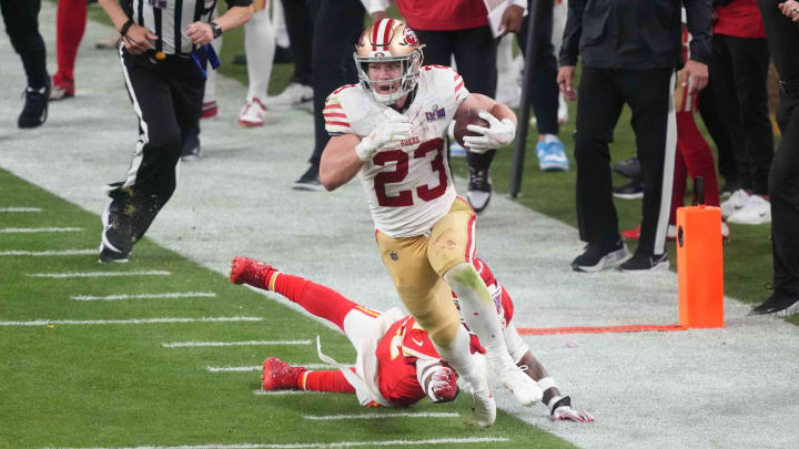Christian McCaffrey runs during overtime of Super Bowl LVIII 