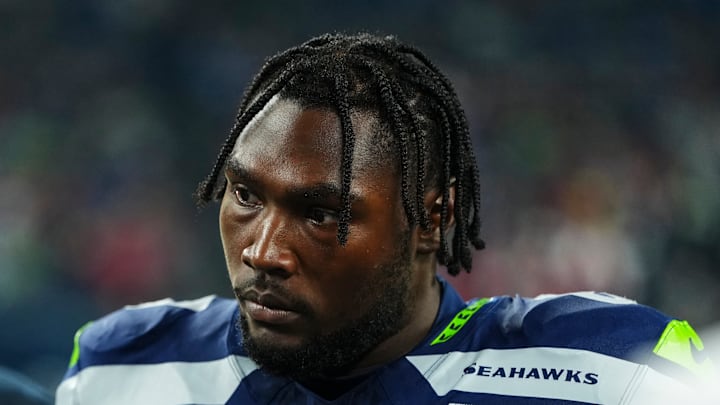 Charles Cross of the Seattle Seahawks on the sidelines