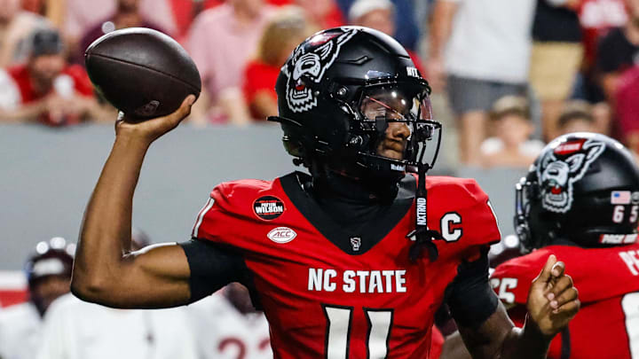 Sep 27, 2025; Raleigh, North Carolina, USA; North Carolina State Wolfpack quarterback CJ Bailey (11) with the ball during the first half of the game against Virginia Tech Hokies at Carter-Finley Stadium. Mandatory Credit: Jaylynn Nash-Imagn Images