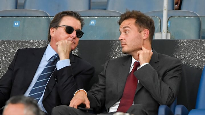 AS Roma president Dan Friedkin and his son Ryan talk during...