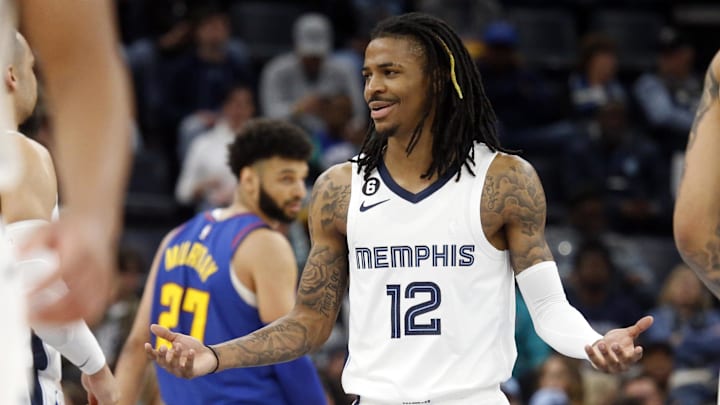 Feb 25, 2023; Memphis, Tennessee, USA; Memphis Grizzlies guard Ja Morant (12) reacts to a foul call during the first half against the Denver Nuggets at FedExForum.