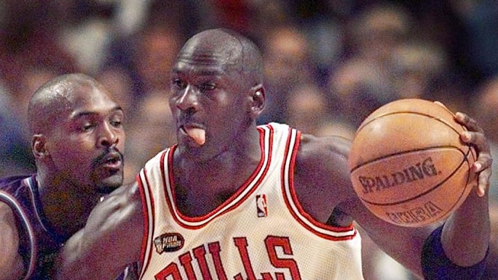 June 12, 1998; Chicago, IL, USA; Chicago Bulls guard Michael Jordan (23), right, goes up against Utah Jazz player Bryon Russell (3) in Game 5 of the 1998 NBA Finals.  Mandatory Credit: Anne Ryan-USA TODAY