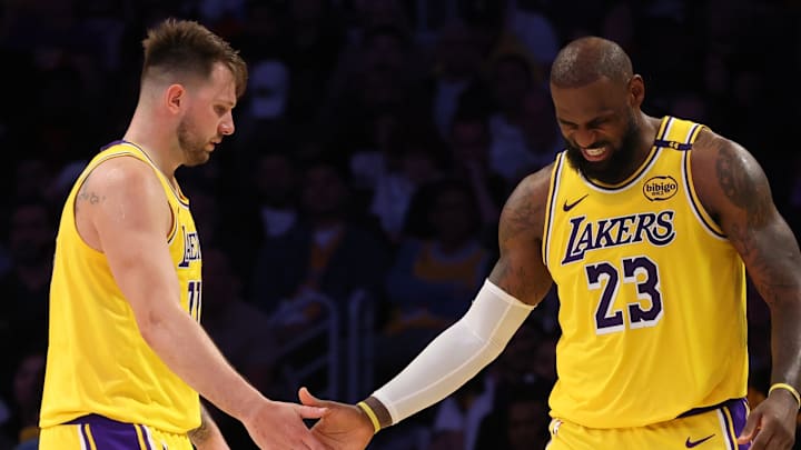 Feb 27, 2025; Los Angeles, California, USA; Los Angeles Lakers guard Luka Doncic (77) and forward LeBron James (23) celebrate after a play during the fourth quarter against the Minnesota Timberwolves at Crypto.com Arena. Mandatory Credit: Jason Parkhurst-Imagn Images