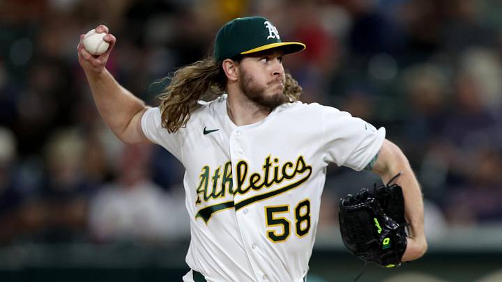 Athletics pitcher Scott Barlow (58) throws a pitch