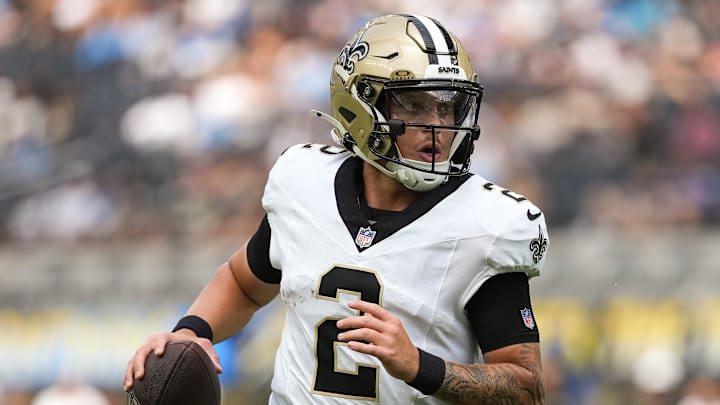 Aug 10, 2025; Inglewood, California, USA; New Orleans Saints quarterback Spencer Rattler (2) scrambles during the first quarter against the Los Angeles Chargers at SoFi Stadium. Mandatory Credit: Jon Endow-Imagn Images