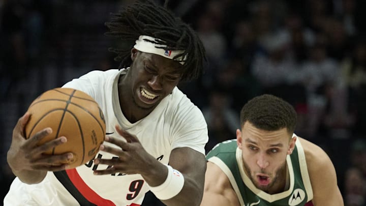 Portland Trail Blazers guard Sidy Cissoko controls a loose ball against Milwaukee Bucks forward Pete Nance Portland Trail Blazers guard Sidy Cissoko controls a loose ball against Milwaukee Bucks forward Pete Nance