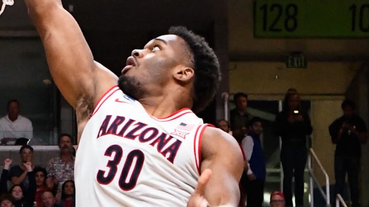 Mar 26, 2026; San Jose, CA, USA; Arizona Wildcats forward Tobe Awaka (30) goes up for two against Arkansas Razorbacks guard Billy Richmond III (24) in the second half during a Sweet Sixteen game of the West Regional of the men's 2026 NCAA Tournament at SAP Center. Mandatory Credit: Eakin Howard-Imagn Images