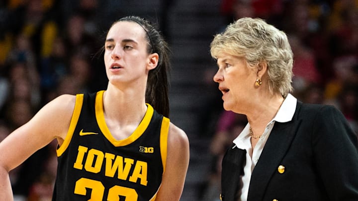 Feb 11, 2024; Lincoln, Nebraska, USA; Iowa Hawkeyes guard Caitlin Clark (22) talks with head coach Lisa Bluder during the third quarter at Pinnacle Bank Arena. Mandatory Credit: Dylan Widger-Imagn Images