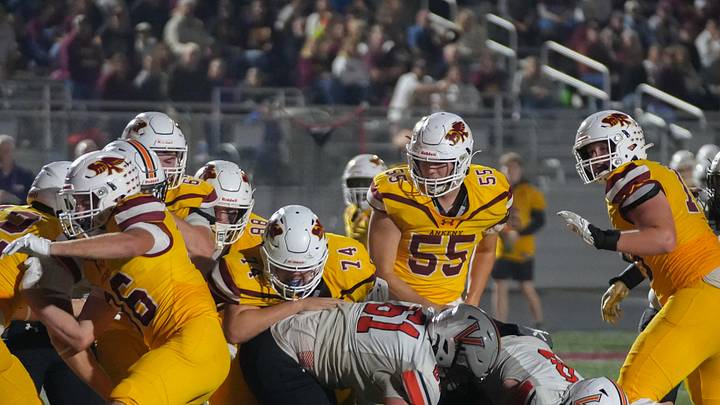 Members of the Ankeny offense fight to reach the end zone in the fourth quarter against West Des Moines Valley during a high school football game Oct 17, 2025, at Ankeny Stadium in Ankeny. Mandatory Credit: Bryon Houlgrave-The Des Moines Register Members of the Ankeny offense fight to reach the end zone in the fourth quarter against West Des Moines Valley during a high school football game Oct 17, 2025, at Ankeny Stadium in Ankeny. Mandatory Credit: Bryon Houlgrave-The Des Moines Register