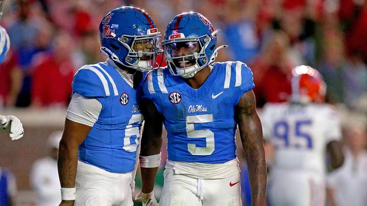 Mississippi Rebels quarterback Trinidad Chambliss reacts with running back Kewan Lacy. Credit: Petre Thomas-Imagn Images Mississippi Rebels quarterback Trinidad Chambliss reacts with running back Kewan Lacy. Credit: Petre Thomas-Imagn Images