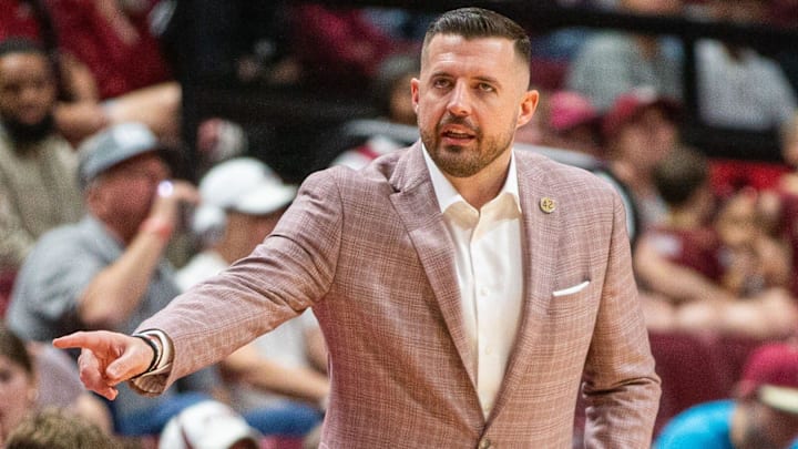 Florida State Seminoles head coach Luke Loucks signals to a player from the sideline. The Florida State Seminoles hosted the Southern Methodist University Mustangs at the Tucker Civic Center on Saturday, March 7, 2026.