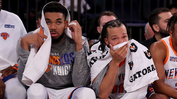 Jan 10, 2025; New York, New York, USA; New York Knicks center Karl-Anthony Towns (32) and guards Jalen Brunson (11) and Miles McBride (2) watch from the bench during the fourth quarter against the Oklahoma City Thunder at Madison Square Garden. Mandatory Credit: Brad Penner-Imagn Images