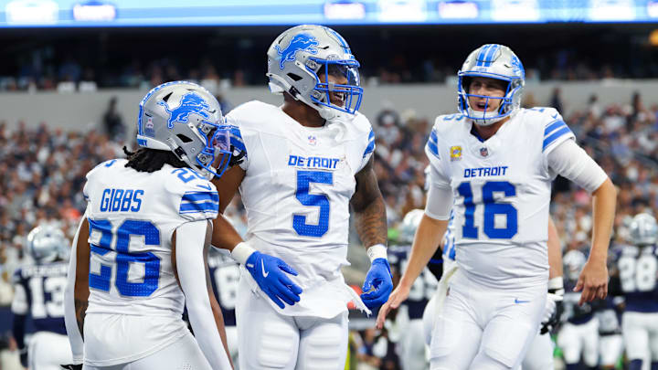 Detroit Lions running back David Montgomery (5) celebrates with quarterback Jared Goff (16) Detroit Lions running back David Montgomery (5) celebrates with quarterback Jared Goff (16)