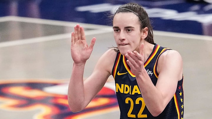 Indiana Fever guard Caitlin Clark (22) claps her hands in excitement Sunday, July 13, 2025, during the game at Gainbridge Fieldhouse in Indianapolis.