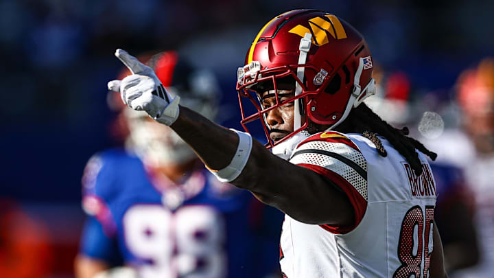 Nov 3, 2024; East Rutherford, New Jersey, USA; Washington Commanders wide receiver Noah Brown (85) reacts after a first down reception during the first half against the New York Giants at MetLife Stadium. Mandatory Credit: Vincent Carchietta-Imagn Images