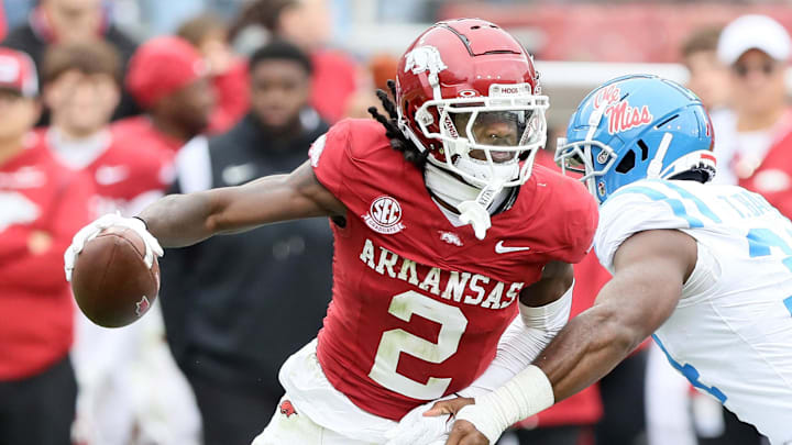 Nov 2, 2024; Fayetteville, Arkansas, USA; Arkansas Razorbackswide receiver Andrew Armstrong (2) runs after a catch in the fourth quarter as Ole Miss Rebels linebacker Tyler Banks (34) defends at Donald W. Reynolds Razorback Stadium. Mississippi won 63-31. Mandatory Credit: Nelson Chenault-Imagn Images