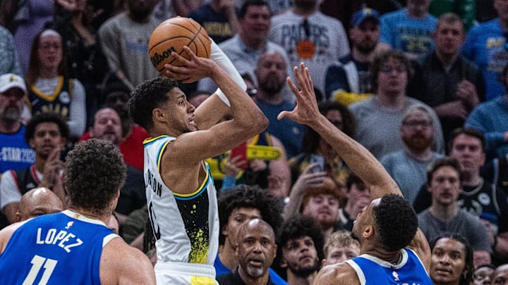 Indiana Pacers guard Tyrese Haliburton shoots the ball and scores tying 3-point basket while getting fouled by Milwaukee Bucks forward Giannis Antetokounmpo.