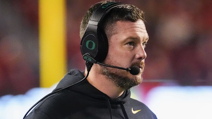 Nov 16, 2024; Madison, Wisconsin, USA;  Oregon Ducks head coach Dan Lanning looks on during the first quarter against the Wisconsin Badgers at Camp Randall Stadium. Mandatory Credit: Jeff Hanisch-Imagn Images
