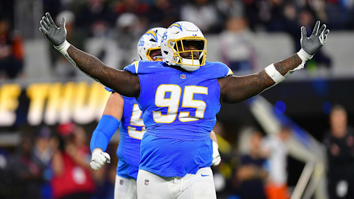 Nov 17, 2024; Inglewood, California, USA; Los Angeles Chargers defensive tackle Poona Ford (95) reacts after sacking Cincinnati Bengals quarterback Joe Burrow (9) during the first half at SoFi Stadium. Mandatory Credit: Gary A. Vasquez-Imagn Images Nov 17, 2024; Inglewood, California, USA; Los Angeles Chargers defensive tackle Poona Ford (95) reacts after sacking Cincinnati Bengals quarterback Joe Burrow (9) during the first half at SoFi Stadium. Mandatory Credit: Gary A. Vasquez-Imagn Images
