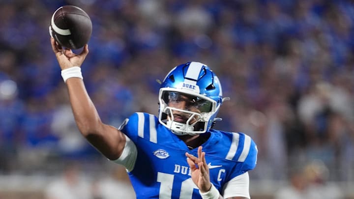 Aug 28, 2025; Durham, North Carolina, USA; Duke Blue Devils quarterback Darian Mensah (10) throws a touchdown pass against the Elon Phoenix during the second half at Wallace Wade Stadium. Mandatory Credit: James Guillory-Imagn Images Aug 28, 2025; Durham, North Carolina, USA; Duke Blue Devils quarterback Darian Mensah (10) throws a touchdown pass against the Elon Phoenix during the second half at Wallace Wade Stadium. Mandatory Credit: James Guillory-Imagn Images