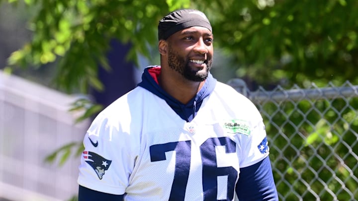 Jun 10, 2024; Foxborough, MA, USA; New England Patriots offensive tackle Calvin Anderson (76) walks to the practice fields for minicamp at Gillette Stadium. Mandatory Credit: Eric Canha-Imagn Images