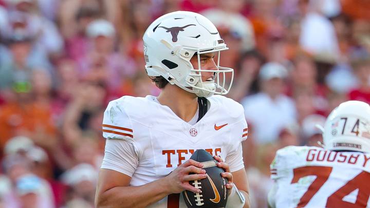 Texas Longhorns quarterback Arch Manning (16) in action during the game against the Oklahoma Sooners at the Cotton Bowl. Texas Longhorns quarterback Arch Manning (16) in action during the game against the Oklahoma Sooners at the Cotton Bowl.