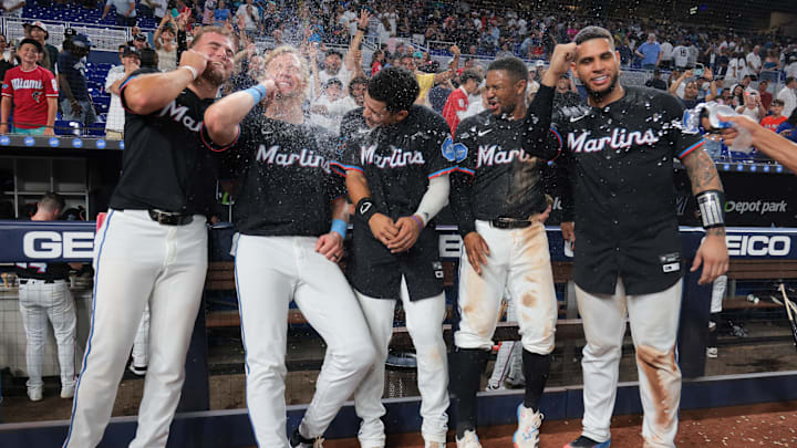 Aug 1, 2025; Miami, Florida, USA;  Miami Marlins center fielder Jakob Marsee (87), left fielder Kyle Stowers (28), third baseman Javier Sanoja (46), second baseman Xavier Edwards (9) and catcher Agustin Ramirez (50) celebrate after winning the game against the New York Yankees at loanDepot Park. Mandatory Credit: Sam Navarro-Imagn Images