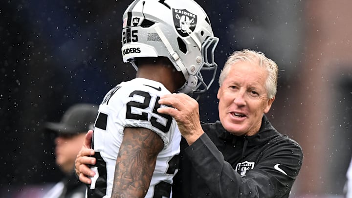 Sep 7, 2025; Foxborough, Massachusetts, USA; Las Vegas Raiders head coach Pete Carroll reacts with cornerback Decamerion Richardson (25) before the game at Gillette Stadium. Mandatory Credit: Brian Fluharty-Imagn Images