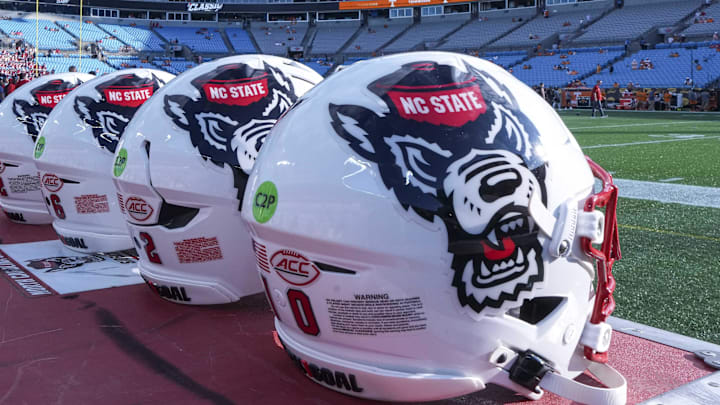 Sep 7, 2024; Charlotte, North Carolina, USA; North Carolina State Wolfpack helmets during pregame activity for the Dukes Mayo Classic against the Tennessee Volunteers at Bank of America Stadium. Mandatory Credit: Jim Dedmon-Imagn Images