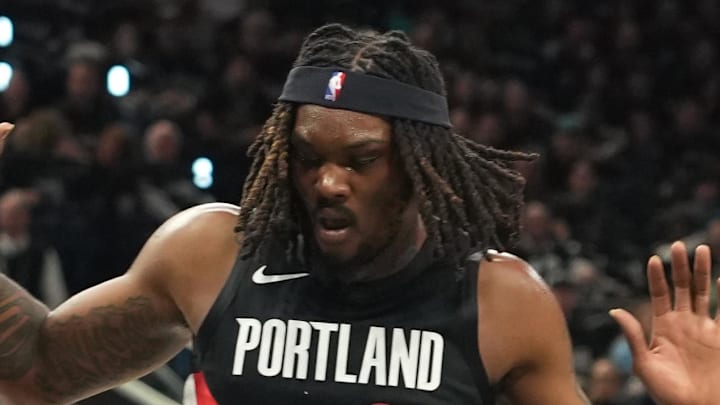 Apr 21, 2026; San Antonio, Texas, USA; San Antonio Spurs forward Victor Wembanyama (1) falls to the ground while driving to the basket past Portland Trail Blazers center Robert Williams III (35) during the first half of game two of the first round of the 2026 NBA Playoffs at Frost Bank Center. Mandatory Credit: Scott Wachter-Imagn Images