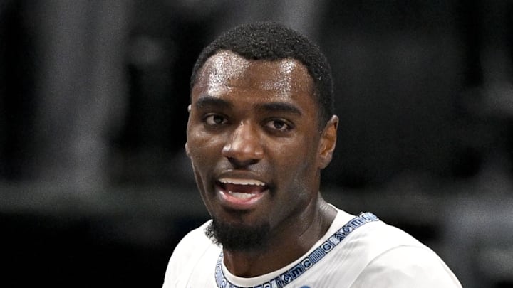 Memphis Grizzlies guard Vince Williams Jr. pushes Dallas Mavericks guard Klay Thompson.