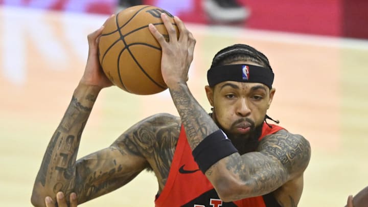 Toronto Raptors forward Brandon Ingram drives between Cleveland Cavaliers center Jarrett Allen.