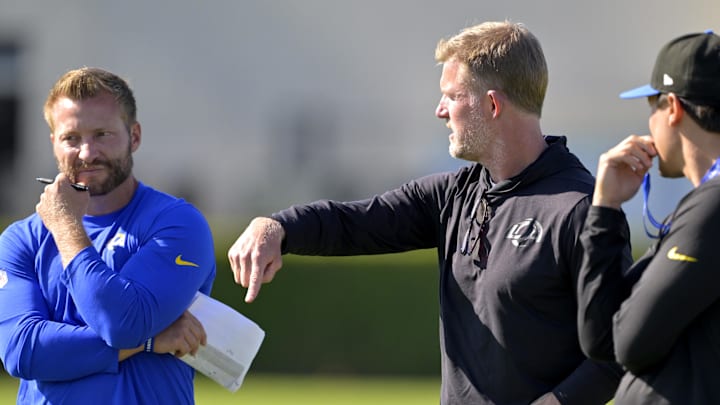 Jul 29, 2024; Los Angeles, CA, USA; Los Angeles Rams head coach Sean McVay, general manager Les Snead and chief of staff Carter Crutchfield talk on the field during training camp at Loyola Marymount University. Mandatory Credit: Jayne Kamin-Oncea-Imagn Images