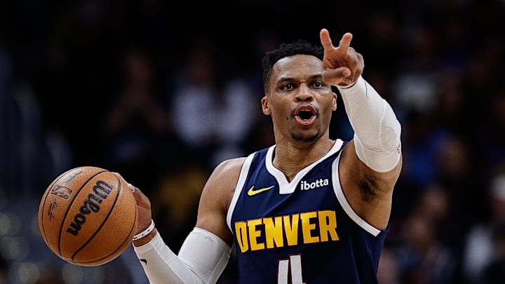 Apr 2, 2025; Denver, Colorado, USA; Denver Nuggets guard Russell Westbrook (4) gestures as he dribbles the ball up court in the third quarter against the San Antonio Spurs at Ball Arena. Mandatory Credit: Isaiah J. Downing-Imagn Images