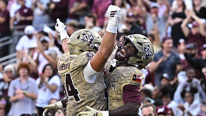 Oct 3, 2026; College Station, Texas, USA; Texas A&M Aggies running back KJ Edwards (0) celebrates after scoreing a touchdown with tight end Richie Anderson III (84) during the first quarter against the Arkansas Razorbacks at Kyle Field. Mandatory Credit: Maria Lysaker-Imagn Images