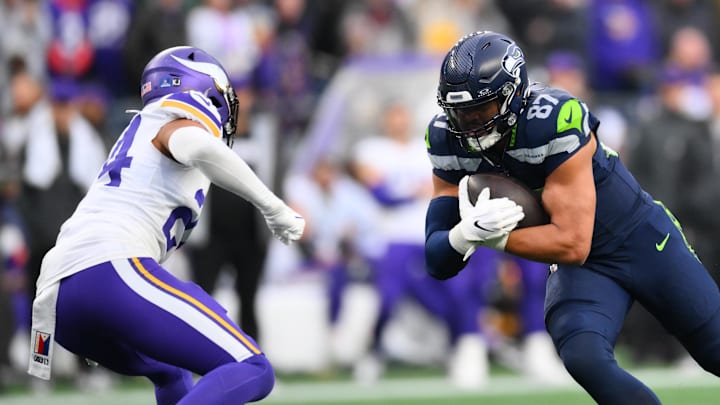 Dec 22, 2024; Seattle, Washington, USA; Seattle Seahawks tight end Noah Fant (87) carries the ball after a catch against the Minnesota Vikings during the second half at Lumen Field. Mandatory Credit: Steven Bisig-Imagn Images