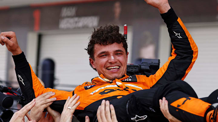 May 5, 2024; Miami Gardens, Florida, USA; McLaren driver Lando Norris (4) celebrates with his team after winning the F1 Miami Grand Prix at Miami International Autodrome. Mandatory Credit: Peter Casey-USA TODAY Sports