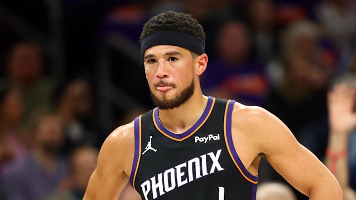 Apr 14, 2026; Phoenix, Arizona, USA; Phoenix Suns guard Devin Booker (1) reacts against the Portland Trail Blazers in the first half during the play-in rounds of the 2026 NBA Playoffs at Mortgage Matchup Center. Mandatory Credit: Mark J. Rebilas-Imagn Images