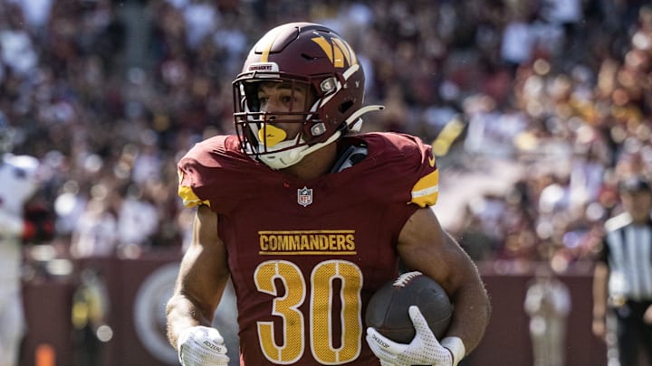 Sep 15, 2024; Landover, Maryland, USA; Washington Commanders running back Austin Ekeler (30) runs the ball for a gain after a reception in the second half against the New York Giants at Commanders Field. Mandatory Credit: Luke Johnson-Imagn Images
Sep 15, 2024; Landover, Maryland, USA; Washington Commanders running back Austin Ekeler (30) runs the ball for a gain after a reception in the second half against the New York Giants at Commanders Field. Mandatory Credit: Luke Johnson-Imagn Images