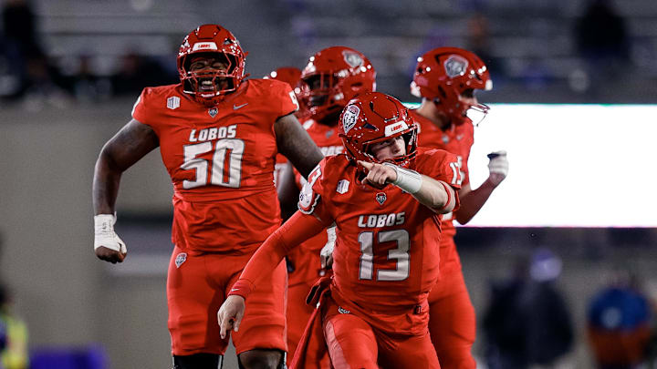 Nov 22, 2025; Colorado Springs, Colorado, USA; New Mexico Lobos quarterback James Laubstein (13) and offensive lineman Isaiah Sillemon (50).
