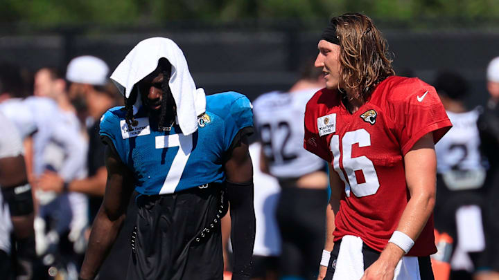 Jacksonville Jaguars quarterback Trevor Lawrence (16) talks with wide receiver Brian Thomas Jr. (7) as they walk off the field with wide receiver Travis Hunter (12), right, after an NFL training camp session at the Miller Electric Center, Tuesday, July 29, 2025, in Jacksonville, Fla. [Corey Perrine/Florida Times-Union]